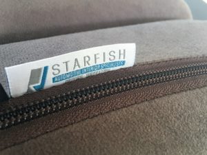 Starfish label sewn onto squab above zip