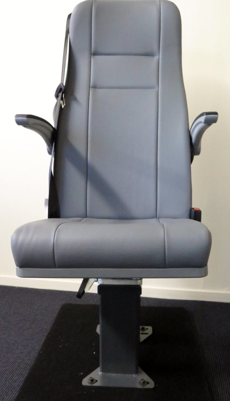 Front view of Shapeshifter seat with cushion in open position, armrests, 3 point seatbelt, grey trim