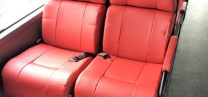 Starfish Interiors custom designed bus seats, red trim