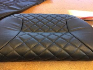 Starfish Products: Charcoal leather seat upholstered with a diamond grid pattern and plain leather sides