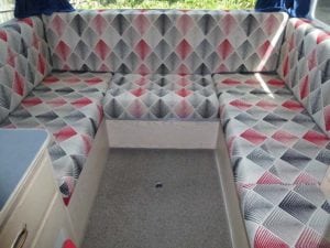 Motorhome seating in red, grey, black and white diamond geometric pattern