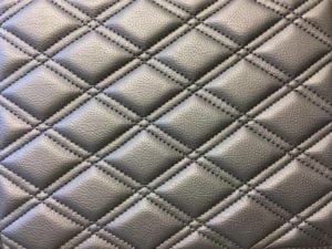 Starfish Products: Charcoal leather upholstery sewn in a diamond grid pattern