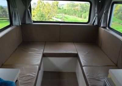 Brown vinyl squabs in main seating area of motorhome prior to retrim