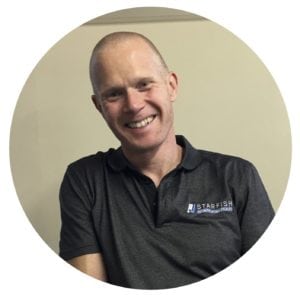 Steven Cherrie in grey polo-shirt with Starfish logo