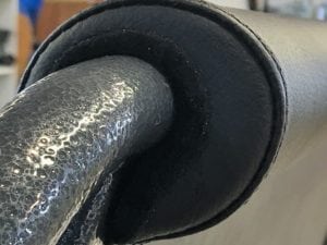 Close up of bus seat grab handle