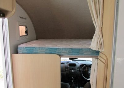 Bed in motorhome with mattress with fabric covered sides