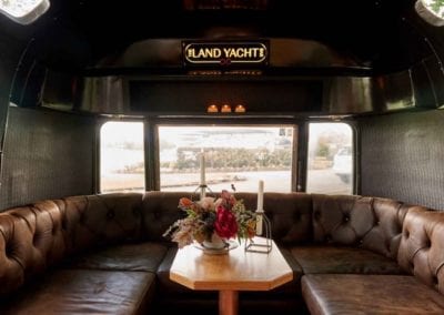 Leather upholstered seating for Land Yacht Bar