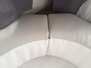 Before refurbishment 6 berth motorhome lounge cushion close up of poor sewing and join.