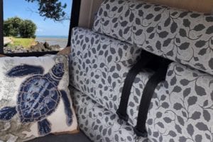 Dinette upholstered in grey floral with a turtle patterned scatter cushion