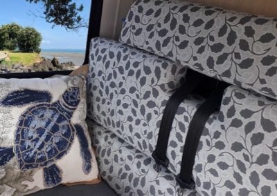 Dinette upholstered in grey floral with a turtle patterned scatter cushion