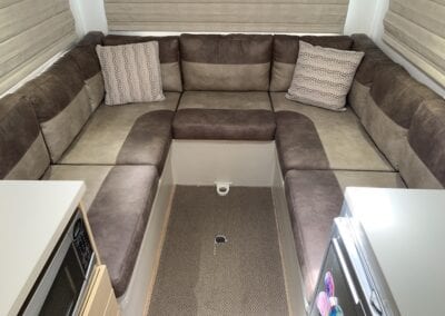 Brown and beige U shaped motorhome lounge