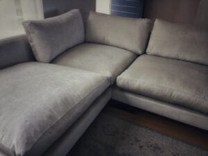Corner lounge suite in grey upholstery